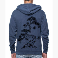 Back of model wearing the heather blue Unisex Hoodie with Japanese pine tree screen print design.