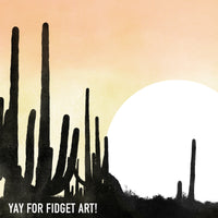 Close-up of desert sunset and saguaro cacti silhouettes.